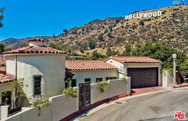 3358 Deronda Drive Los Angeles, California All Inclusive Luxury Living down to the finest detail. Unpack your bags and take up residence in this Fully Furnished, Classic Spanish Colonial Revival circa 1926, with a wonderful mix of quintessential charm of the era along with modern updates and conveniences of today. Walled at the street for privacy, the property is a peaceful sanctuary with verdant terraced gardens, stone pathways and extended views of the Hollywood Hills, the Hollywood Sign and city lights. Property has 4 Bedrooms, 3.5 Baths, Home Office, Home Gym, Formal Living Room, Formal Dining Room and Media Room, all outfitted for today's "Work from Home" standards. Agents please read Private Remarks.