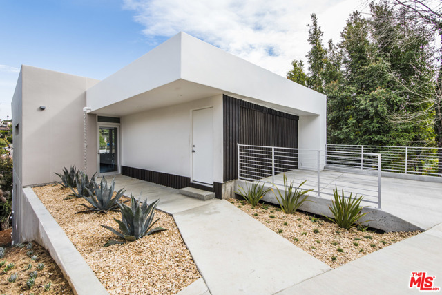 3354 Troy Drive Los Angeles, California Serene canyon views, contemporary open spaces and abundant natural light are the hallmarks of this brand-new construction in the Hollywood Hills, designed by RCDF Studio and Rogerio Carvalheiro. Completely open floorplan on entry level and wood floors throughout. Kitchen offers custom cabinets, high end appliances, marble counters and center island serving as a breakfast bar and focal point. Living and dining spaces all flow together with an east facing wall of glass that opens out to a spacious patio, ideal for outdoor entertaining and dining, and a front row seat of the view. First floor includes a powder room. Downstairs is a well-appointed master bedroom with large walk-in closet and luxurious bath with dual showerheads. Two additional downstairs bedrooms share a Jack-and-Jill bath. Property includes 2-car garage. Great location with easy access to studios, freeways, the valley, and one of the best Whole Foods in the city, in a brand-new home requiring the most minimal of upkeep.