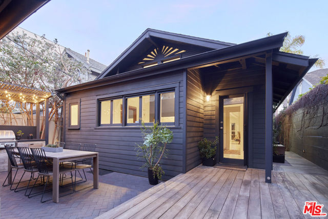 225 Windward Avenue Venice, California Step inside this one-of-a-kind artist's retreat, just steps to the beach and Abbot Kinney Blvd - arguably the best location in Venice! This fully restored Venice Beach bungalow is filled with high-end details throughout. The wood + brass room custom room divider is truly a piece of art, paired with the brass inlay surrounding the dining area, and lapis fireplace hearth. Designed for modern living, this home is the perfect place to entertain, relax, rejuvenate, and work from home in the custom built-in office area. The high ceilings with skylights create a sense of zen and tranquility with natural light beaming throughout. Spend your evenings taking a soak under the stars in your Japanese soaking tub, surrounded by the beauty of the palm trees and ocean breeze. This custom home offers a wealth of storage, and rare detached two-car garage, offering the opportunity for extra live/work space. Walking distance to Hotel Erwin, Belles Beach House, Gran Blanco, Winston House, Abbot Kinney, and the luxurious NeueHouse, this home is a once in a lifetime opportunity to live the best of Venice Beach.