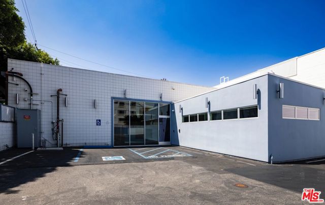This fully renovated property sits on a corner lot and contains 2 separate structures consisting of a 3,996 SF office building and a separate 920 SF stand-alone structure for office or retail. The Property underwent a $1,600,000 renovation that included a change-of-use to office in 2021. The main building contains 6 executive offices, 2 smaller offices or file rooms, a large conference room, full kitchen, 4 bathrooms, I.T. room, storage rooms as well as large built-in work spaces in the center. 12-foot-tall windows, frameless glass offices, and 17-foot tall exposed wood beam ceilings make the interior bright and expansive. 3 separate HVAC systems allow for efficient cooling / heating zones for each office. The large kitchen includes Caesarstone countertops and new appliances including a washer / dryer. The smaller structure includes 1 bathroom and can be divided into 3 offices, with room for more. Large storefront glass with the main entrance on 14th Street makes this space ideal for a pedestrian-oriented business and offers a 2nd source of income for the property owner.  1762 14th Street is uniquely positioned as an ideal owner-user office space in one of the most coveted cities in the world. The location and its proximity to the expanding tech and media company landscape makes this a rare and prestigious opportunity.