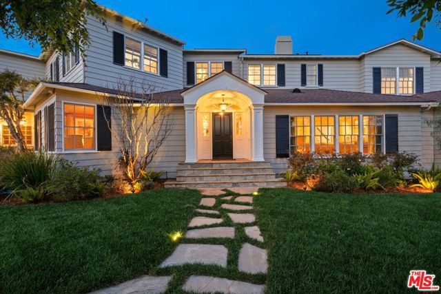 360 S Anita Avenue Los Angeles, California Set upon a highly coveted corner lot in Brentwood, this Traditional East Coast-style estate boasts six bedrooms and seven bathrooms among an expansive 6,592-square-foot floor plan. Pairing classic details with modern flair, the home features multiple light-filled living spaces on the main level, in addition to a formal dining room and state-of-the-art chef's kitchen with an extensive butler's pantry, two dishwashers, wet bar and built-in wine fridge. Upstairs, find three spacious bedrooms, including the immense primary suite with vaulted ceiling, travertine fireplace, access to its own balcony overlooking the backyard, and two spa bathrooms with a double-size shower, jetted tub, dual walk-in closets and skylights. A true Brentwood oasis, the home's lush outdoor space is embraced by hedges and features a solar heated pool and spa, stone fireplace, built-in BBQ and pergola-shaded dining space for unrivaled relaxation or entertaining. Conveniently located just moments from San Vicente yet a seeming world away, this estate sets an entirely new benchmark for sophisticated California living.