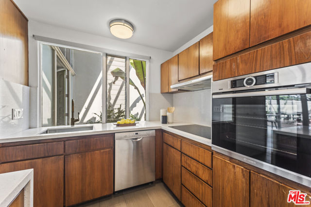 Large kitchen window looking to entry/courtyard