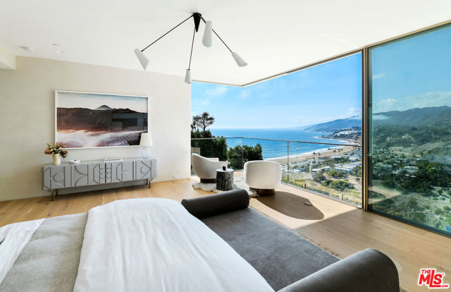 325 Mount Holyoke Avenue Pacific Palisades, California Situated on the bluff with panoramic views of the mountains and ocean, and just a short stroll to Palisades Village -- this property truly encompasses luxury coastal living at its finest! This exceptional new construction located in the highly coveted Palisades Via Bluffs boasts incredible ocean views and impeccable modern design. The spacious floorplan includes 5 bedrooms and 5.5 baths with an office space. This property was custom designed and built by the renowned building and design team, David and Eliana Rokach. Property highlights include an infinity edge pool, full basement level with natural light, and a large rooftop deck with hot tub. Top-of-the-line design and craftsmanship are evident in every detail of this stunning home.