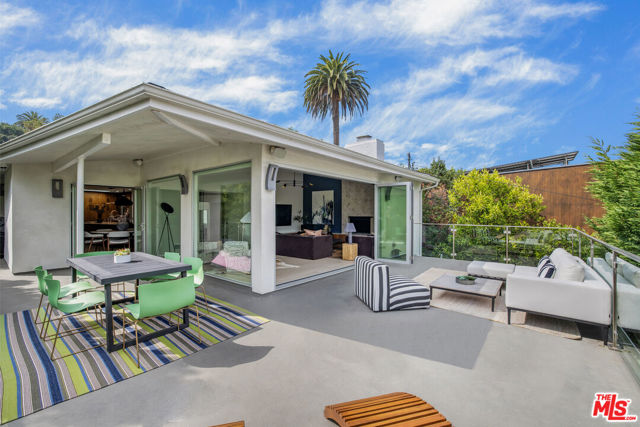 279 Mabery Road Santa Monica, California This modern Santa Monica Canyon, turn-key beach house, has been recently renovated and is situated on the coveted Mabery Road in the highly acclaimed award-winning Canyon Charter Elementary School district. The four-bedrooms, four-bathrooms, abundance of natural light, two decks, and tranquil treetop views, all create an exceptional indoor/outdoor flow. Entering in the main/upper level you're greeted with an abundance of natural light coming from the great room expansive floor-to-ceiling glass and bi-folding doors that open to an expansive wrap-around entertaining deck space. Continuing to the other side of the deck and back inside to the dining area which opens into the skylight lit kitchen with a large center island, bar seating and surrounded by custom cabinetry, chic designer finishes, and top-of-the-line stainless steel appliances. The main level also includes a bedroom suite that can double as an office. Heading downstairs to the three additional bedrooms, all with full ensuite bathrooms, an end-to-end deck connecting the primary suite to one of the guest suites, and a laundry room. In addition to the attached converted two-car garage, the driveway allows for additional parking. Serene tree top and canyon views along with cool ocean breezes, all moments to boutique shopping on Montana Avenue, Will Rodgers State Beach (secluded access from Mabery Rd.), Ocean Avenue bluffs, bike paths, Santa Monica stairs, award-winning restaurants, and artisan coffee shops. Also, moments to the Palisades Village, Malibu, and Brentwood. A perfect move-in condition home in one of the most desired and best luxury coastal neighborhoods of West Los Angeles.