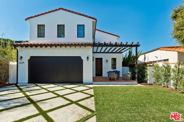 2229 Walnut Avenue Venice, California Located on a prime tree-lined street East of Lincoln Boulevard, this Spanish-style residence offers the opportunity to experience the finest in luxury living while being situated within walking distance to Venice's famed beaches, restaurants, boutiques, and parks. Spanning over 3,200 square feet, this contemporary home has been designed with all the romance of an original Spanish home reimagined for the modern-day, highlighted by authentic wrought iron detailing, plaster walls, a Spanish shingled roof, and a clay-tiled front veranda. The attention to detail continues inside with a dramatic double-height entry foyer, an exquisite staircase with decoratively tiled risers, romantic archways, and elevated ceilings throughout. A bright and open floor plan seamlessly blends the impressive living and dining areas accompanied by a high-end kitchen, complete with expansive stone countertops, bespoke hardwood cabinetry, and chef-grade appliances. Ideally positioned throughout the home for a variety of uses, three sizable secondary bedrooms all feature designer ensuite bathrooms while the exceptional primary suite overlooks the lush backyard and stands out with a walk-in closet and ensuite bathroom accented by spa-grade fixtures. To take advantage of the acclaimed Southern California weather, numerous oversized bi-fold doors encourage an indoor/outdoor lifestyle, leading to an ample backyard, finished with a private patio and inviting fire pit. Expertly positioned on a nearly 6,000 square foot lot, the home and property allow for any and all future outdoor recreations or additions desired. Rounding out the luxe upgrades found throughout the home is an additional half bathroom on the main floor, an attached one-car garage, central air conditioning, smart home technology, and a dedicated laundry room.