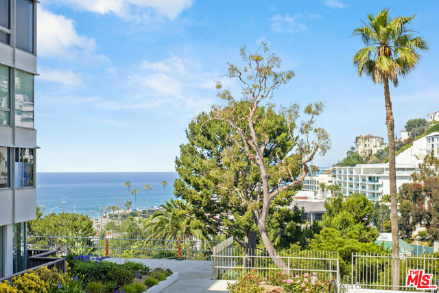 Located in the prestigious Edgewater Towers, this Pacific Palisades condo has the perfect balance of breathtaking ocean views coupled with a clean remodel and one of the best locations in the complex. Located in the Del Mar building, this unit is tucked away in a private location on the first floor. Access could not be any better, with the parking space and pool/spa located immediately outside the unit. With almost 1,100 square feet, this open floor plan features a large living/dining room with a wall of ocean view windows, polished concrete floors, marble facade fireplace, open kitchen with bar seating, newer granite counters/backsplash and upgraded appliances. Bathroom is upgraded with Carrara marble finishes. Private spacious bedroom with walk in closet. Amenities include two saltwater pools, lighted tennis court, basketball court, picnic area, gym, dog run, hiking trails throughout the 9 acres overlooking the ocean and mountains, and 24/7 guard gate. Don't miss out on this resort style opportunity in on of the most coveted condominiums in the Pacifc Palisades.