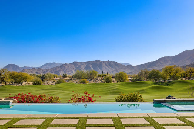 Welcome home to Bighorn Golf Club, the most exclusive private club in the Coachella Valley. This property is perfectly elevated on the 16th fairway of the Mountains Course. The main house features a formal living and dining room, kitchen and family room area, four bedrooms and four bathrooms. Outside the front courtyard is a private casita, featuring a full en-suite bedroom on the first level and a movie theater and kitchenette downstairs, complete with full bathroom. Enjoy a spacious layout of close to 5000 sq ft of living space. Enjoy breathtaking sunrises in your backyard, with east facing mountain and golf course views. Generous lot size and modern pool with turf backyard. Owned solar system. Bighorn Golf Club has exclusive luxury amenities with an impeccable reputation of service standards. Welcome home to the Bighorn lifestyle.