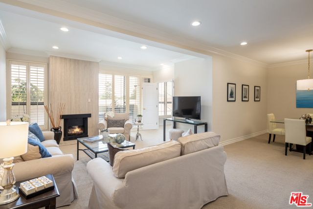 15515 W Sunset Boulevard 408 Pacific Palisades, California Sophisticated 3 bed/2 ba updated condo filled w/ natural light & located in the heart of the Palisades Village. Entry w/ tiled floor & closet opens to living rm w/ chic tiled fireplace & large windows & sliding dr to balcony overlooking treetop & hillside views. Spacious dining rm opening to bfast rm w/ sidexside laundry area. Updated kitchen w/ all new s/s appliances, granite cntrtops, marble floor & open quartz-top breakfast bar opening to living rm, ideal for entertaining. Large primary ste w/ treetop views, custom walk-in closet & updated 3/4 ba w/ new marble finished sink/cabinet. 3rd bdrm/den/office, ideal for working at home w/ open views. Features incld led recessed lghtg, central ac/heat, crown molding, updated bthrms, newly painted. HOA includes EQ insurance, pool, spa, gym, 2-secured tandem pkg & extra storage, pets ok & guest parking. Enjoy the Palisades lifestyle w/ the new Village shops & restaurants, Temescal Canyon hiking & Will Rogers Beach just outside your door!