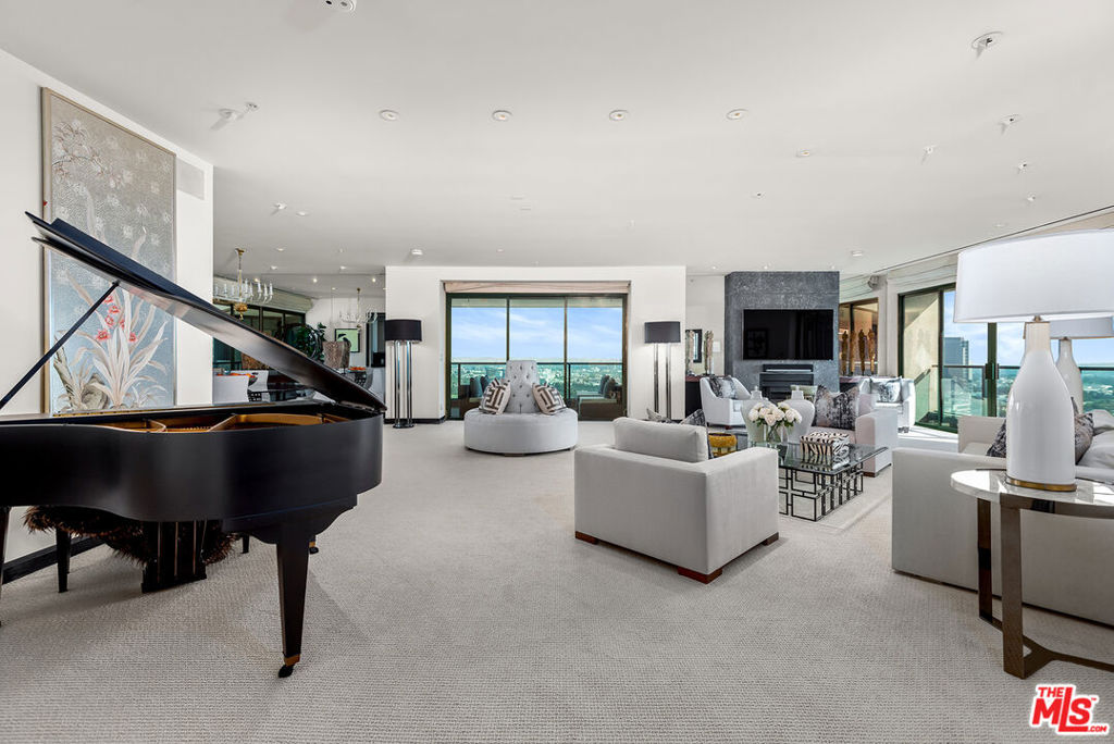 10490 Wilshire Boulevard 2303 Los Angeles, California Great opportunity to own this rare southeast, rear facing, 3,499 square foot condominium featuring forever views of Bel-Air, Century City, Downtown L.A., snow on the San Gabriel Mountains, Griffith Park Observatory, & the ocean from the 23rd floor of the desirable full-service Blair House! Center hall plan with 3 bedrooms, 3.5 baths + large den with wet bar. Every room except 1 opens to a balcony! Tremendous living room with fireplace flanked by built-in shelving. Separate formal dining area. Cook's kitchen with lots of storage & breakfast area. Generous primary suite includes 2 large walk-in closets & huge master bath with 2 sides, spa tub, vanity area, 2 commode rooms. 2 additional generous sized ensuite bedrooms on the other side of the unit from the primary. Laundry room with sink & ample storage throughout. 3 zones of heating & AC. Simply the best floor plan in the City. 24 hour security, valet, huge newly remodeled saline pool & spa, north-south lighted tennis court, gym & rec room. Also available for lease.