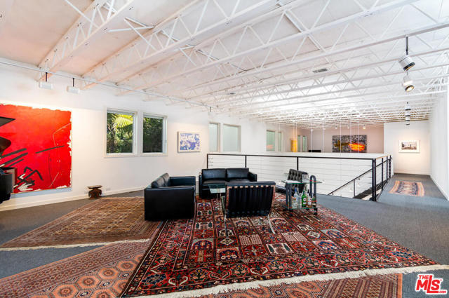 703 Milwood Avenue Venice, California One of the first postmodern Neo Industrial style homes built in Venice. This impeccably maintained, 4,672 sq. ft. artist in residence home was brilliantly designed by Ronald Howell, Architect (AIA). The timeless design is perfect for today's needs with so many of us living & working from home. The exterior is unassuming with clean lines & an air of simplicity. Situated on a prime 5,854 sq. ft. corner lot in the heart of the vibrant Venice community, it is just minutes to Abbot Kinney & the beach. High windows are carefully placed for privacy, security & placement of artwork. All doors are 9'. 16 skylights allow for an abundance of natural light. This versatile space has multiple entrances for seamless entertaining & work flow, without compromising the privacy of the primary living area. Your staff could be working downstairs unaware you're in your jammy's upstairs. There is a separate guest quarters & music studio with a lead lined vocal booth. 4 car garage + 2 exterior spaces.
