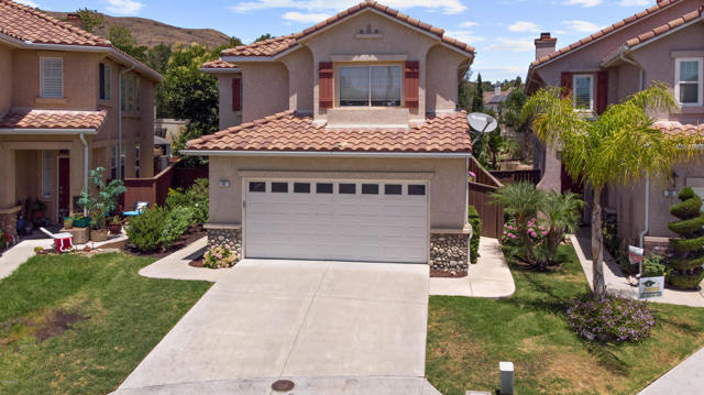41 Mahogany Lane Simi Valley, California Gorgeous home located on a cul-de-sac in the desirable Wood Ranch area. This potential 4 bedrooms and 2.5 bathrooms home boasts nearly 2,100 square feet. The front entry welcomes you with travertine flooring throughout the downstairs, open and spacious living room with dining area. Kitchen features granite counter tops, stainless steel appliances, recessed lighting, eat-in dining area, breakfast bar and open to additional living space with built-in cabinet. Upstairs offers newly installed laminate flooring, two bedrooms with a shared bathroom and laundry room. Across the hallway is the large main bedroom with plantation shutters, peekaboo mountain views, walk-in closet and ensuite bathroom offering a large vanity area with double sinks, soaking tub. The potential 4th bedroom/office/den has plantation shutters. Step outside to your low maintenance backyard with stamped concrete, turf and pergola. This is a must see! Come see all that this home has to offer. Welcome home!