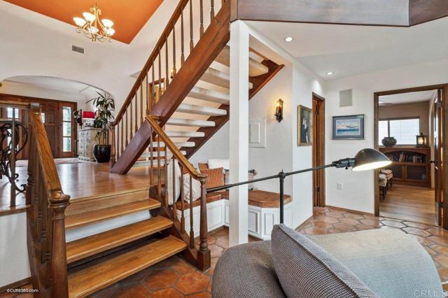 Additional living room built-in sitting space below the stairs.