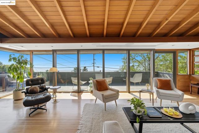 Sunroom with wood finished floors and wood ceiling
