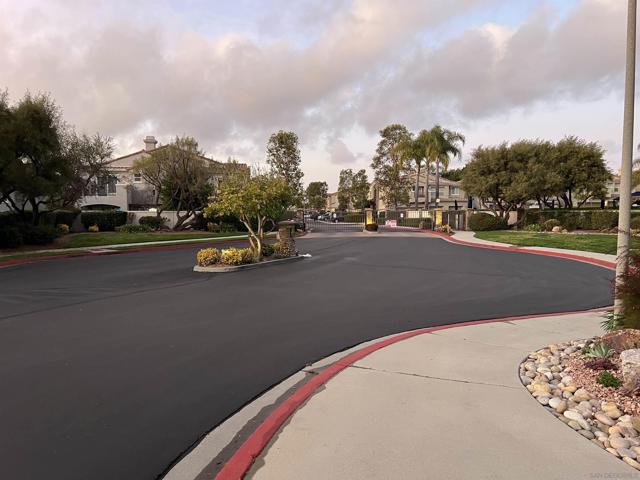 GATED COMMUNITY ENTRY ROAD.