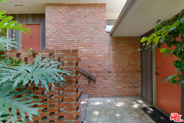 306 22Nd Street Santa Monica, California This classic Mid-Century Modern home, architect designed and professionally landscaped is on the market for the first time in 60 years. In the most prime location, North of Montana on a cedar lined street. This creative oasis is surrounded by old growth trees and fruit trees. Set in a curated lightly natural landscape on view from multiple walls of windows throughout the home. Entering into a large open living room and library with an original wood burning fireplace, one flows through a galley style kitchen with ample cabinet space into the heart of the home: A high wood beam ceiling perfectly proportioned family/dining room with a wood burning fireplace. Two walls of windows look out onto a gorgeous patterning of trees, shrubs and flowers. It's like living in the garden with all the comforts of an indoor room. This split-level home has 2 bedroom and a bath downstairs. The upstairs master suite and bath has a large west facing window sliding open onto the an intimate balcony overlooking the garden. Indoor/outdoor living at it's best. Enjoy the ultimate Santa Monica lifestyle from your own private sanctuary.