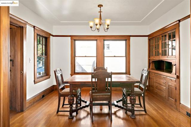 Dining area featuring light wood-style flooring and a chandelier
