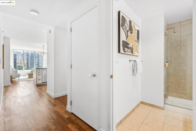 Hall featuring a chandelier and baseboards
