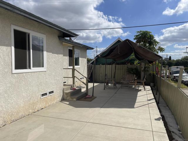 Large concrete patio with enclosed fencing