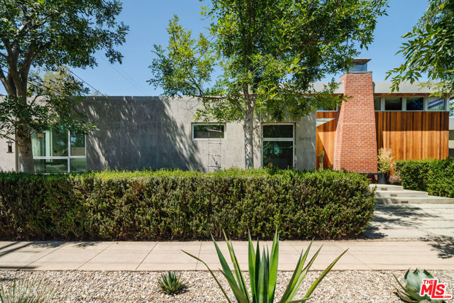 1909 Glyndon Avenue Venice, California Bright, open and architecturally stunning! This three bedroom, two and a half bath, Mar-Venice home is magazine worthy (featured in the LA Times in 2014). The thoughtfully designed open floor plan is drenched in natural light from floor to ceiling windows and a wall of sliding glass doors. The gleaming kitchen includes a large island, two sinks, walk-in pantry and high end appliances. There are two large primary bedrooms with en suite bathrooms and a third bedroom perfect for an office, guest quarters or den. The backyard, just through the sliding glass doors off the main living space, is ideal for effortless entertaining. Enjoy built in seating and bbq in a lush garden setting (including roses, wisteria and citrus trees). Additional perks include direct access via the garage, a dedicated laundry room and solar panels! Located on a quiet residential street with proximity to amazing westside restaurants and shops.