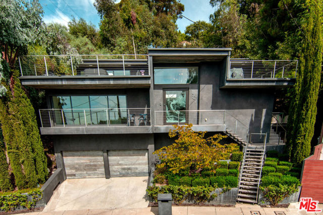 1507 Tower Grove Drive Beverly Hills, California Recently finished Architectural on desired Tower Grove Dr in BHPO. 3 bedrooms, 3.5 bath, open floor plan, smart-home technology, home theater/media room, fire place in living room, two extra-large outdoor patios, one off the master with city views all the way to the pacific ocean. Stunning views of city lights in evening from master and living room. Very bright house in quiet neighborhood minutes from downtown BH. Everything is completely done, easy to maintain, furniture is included just move in. Art (paintings/sculptures) NOT included.