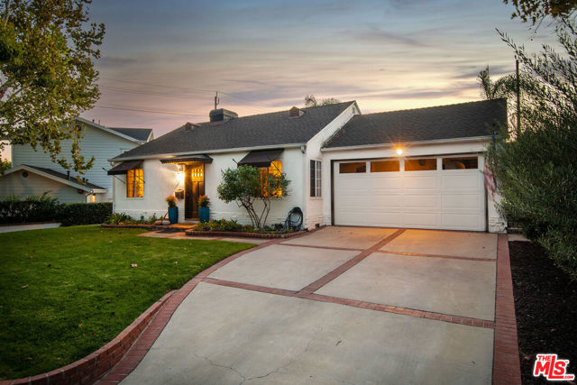 607 N Priscilla Lane Burbank, California Captivating Toluca Woods turnkey 2+2 1,328 sq. ft. single story home set back on prestigious tree-lined lane. Attractive front landscape is accented with brick. Spacious living room with hardwood floors flows to open kitchen and dining room, keeping the cook in the social mix. Stainless steel appliances include refrigerator, gas range, hood and two dishwasher drawers, medium tone Shaker-style cabinetry, neutral granite countertops and ceramic tile floor. Two lovely light-filled bedrooms have hardwood floors. Two bathrooms with updated fixtures and ceramic tile floors. Primary bathroom has giant shower. Inviting Saltillo-tiled fireside family room opens to beautiful outdoor oasis featuring spectacular cobalt tiled pool with spa, swim up bar, multi level decking, covered patio and al fresco dining gazebo for ultimate entertaining. Two-car garage could be converted to ideal office/studio space. Perfect location for creative artists, musicians, studio/entertainment industry. Minutes to cafes, fine dining, recreation & more. Top school district.