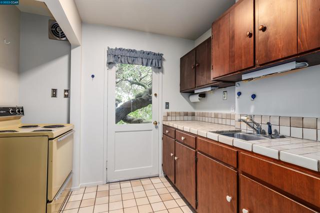 Extra kitchen on lower level or alternate laundry room potential