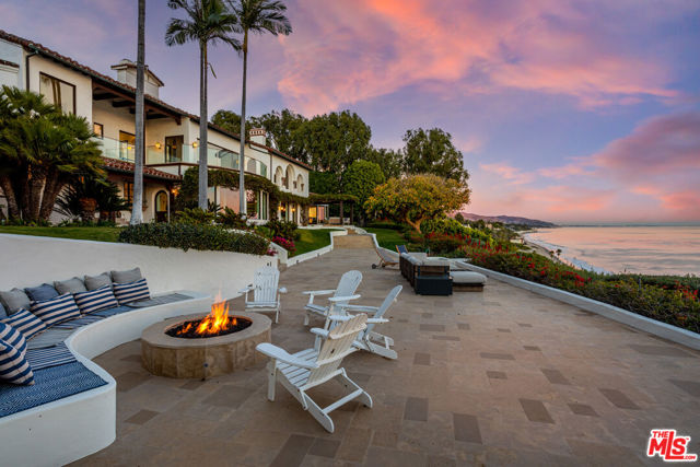 Breathtaking Malibu Oceanfront Estate located on the bluffs of the world-renowned Paradise Cove Beach in Malibu, California.  Situated on a private road, this legacy estate is the ultimate in privacy, security, and seclusion.  The property encompasses approximately 6.62 acres with direct beach access and 339' of beach frontage.  Panoramic ocean views of the famed "Queen's Necklace" from Palos Verdes to Pt. Dume with beautiful views of Catalina Island.  Captures indoor-outdoor living with full ocean views and most rooms opening onto the expansive deck and covered patio areas that surround the main house.  Ten to twenty foot tall walls and fencing encompass the property providing the ultimate in privacy.  The second awe-inspiring twenty foot tall double door gate leads you into the main interior of the estate property.  Smart house features include security cameras, Lutron lighting, automated shades and multizone air conditioning.  The main house boasts approximately 16,836 sq. ft. offering a formal grand entryway, open kitchen with two center islands and top of the line appliances, full ocean view dining room and living room areas, six bedrooms with en-suite baths, four additional baths, two formal reception rooms with full ocean views, two spacious ocean view offices with private balconies. The main office, with a kitchenette, has a separate staircase for entertaining clients while working from home.  A fabulous 14-Seat Home Theater with a row of D-BOX seating for your viewing entertainment.  There is an upstairs large den that can be used for many different purposes such as another bedroom, office, exercise room or other desirable options.  Both the mudroom and laundry room are conveniently located within the estate.  There are seven beautiful fireplaces located with the main estate- in the two reception rooms, living/family room, primary bedroom, primary  bedroom sitting room, guest bedroom and the guest house.  The property offers destination resort-style living with a self-contained Guest House, a gorgeous infinity pool surrounded by lush landscaping consisting of grassy lawn areas, redwood trees, eucalyptus trees, coral trees, palm trees, fruit trees and a rose garden, pool room and audio-visual room, ocean-side spa with panoramic views, north/south lighted tennis court, outdoor shower located along the stairs to and from the beach, outdoor barbeque and pizza oven with ocean views, and a 9-hole mini-golf course.  Nothing compares to this exceptional Malibu Oceanfront Estate located on the most incredible beach in the world for the ultimate beach life.