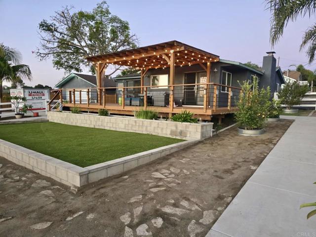 Two-car garage is visible to the left of the house
