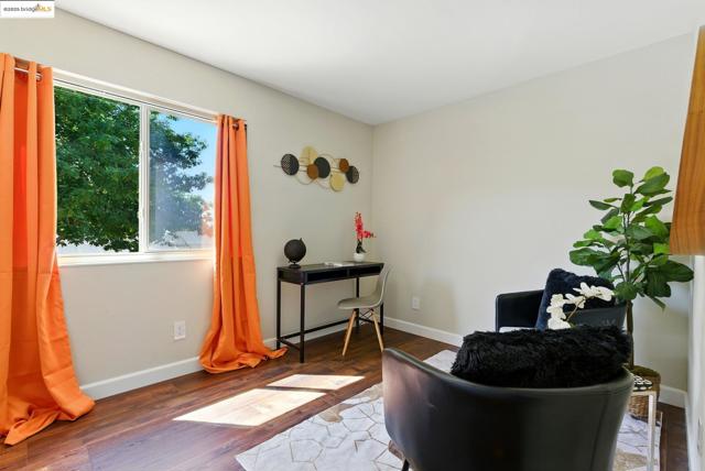 Living area featuring healthy amount of natural light and wood finished floors