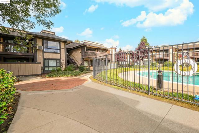 View of home's community featuring stairs, a pool, a residential view, and a patio area