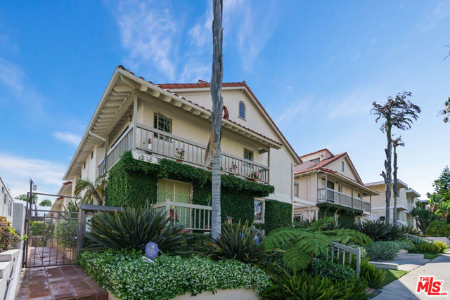 818 18TH Street B Santa Monica, California Terrific 3-bedroom townhouse in an unbeatable, Santa Monica location! This beautifully updated unit has a classic floor plan - main level with common area rooms; upstairs with bedrooms and bathroom; downstairs with bonus room, laundry area, and direct access to 2-car garage. Wood floors adorn the living room, dining room, and kitchen. The main level also features two outdoor patio spaces - one is accessible from the living room, one is accessible from the dining room. The kitchen has been beautifully updated and showcases a gorgeous blue glass backsplash, stainless steel appliances and newer cabinets. The primary, en-suite bedroom features soaring ceilings, multiple closets, newer bathroom update, and loft that leads to the rooftop deck. The other two upstairs bedrooms share the full bathroom, at the end of the upstairs hallway. The downstairs bonus room offers a great "flex" space. This is a truly fantastic property!