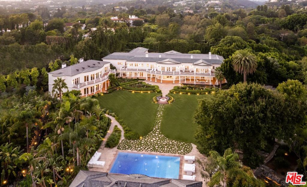 AUCTION: Bid 9-23 May | Listed for $55M | No Reserve | Starting Bids Expected Up To $38M | Showings by appointment.Indulge in luxury living at the Azria Estate, a gorgeous Los Angeles mansion located in the Holmby Hills neighborhood known for some of the most historic and iconic estates in the city. Designed by legendary architect Paul Williams, this luxurious property merges colonial architecture with modern amenities, resulting in a chic and timeless experience. This world-class property offers the utmost privacy and is set behind a long, gated driveway, providing security and peace of mind. The main house offers ample space for entertaining inside and outwith a catering kitchen and infinity pool with its own sauna. A separate 5,500-square-foot building hosts a theater, game room, and stunning home office. All 14 bedrooms have thoughtful and elegant design. The entire mansion plays host to a modern atmosphere with bright, airy colors and warm wood floors. The beautifully manicured grounds include rolling lawns, mature trees, a tennis court, a lush Japanese and Mediterranean Garden, and a greenhouse for growing produce. This home is the epitome of entertainment, where large get-togethers, movie screenings, high-scale fashion events, and charity galas seamlessly unfold, making every occasion an unforgettable experience. This distinguished estate is the height of elegance and privacy, with a flawless layout perfect for family, staff, and guests.