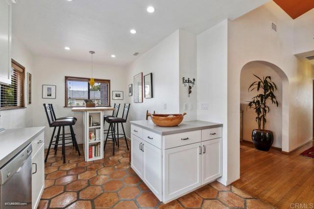 Kitchen is complete with custom built-in island for casual dining and extra storage