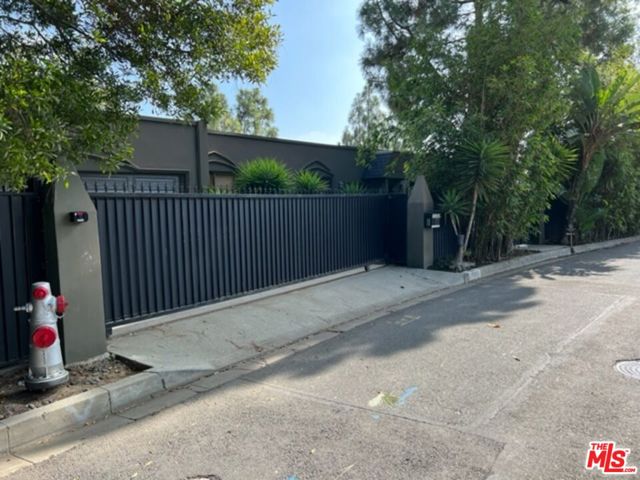 An incredible opportunity to remodel or rebuild and create spectacular value/upside. Property is street to street, over an acre, and located at the end of a very prime cul-de-sac north of Sunset in the City of Beverly Hills surrounded by multi-million-dollar estates. Very impressive frontage on one of Beverly Hills most prime streets, enter through private courtyard to 3-story home built in 1957, features large living room, gourmet kitchen, family room, large owner's suite and 4 other bedrooms. Property features stunning city views spanning across the LA Basin. There is a pool, deck, and terrace, property is sold in its as-is condition. An incredible value and opportunity.