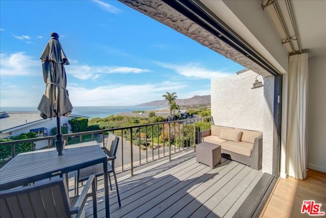 Rare opportunity to own a newly renovated townhome in coveted Zuma Bay Villas with white water and coastline views. Beautiful new finishes, wiring, plumbing, windows, and features including new Heating and A/C, new windows and a pocket sliding door in LR to give you great entertaining access to the expansive ocean views.  The upstairs features a primary bedroom  that feels like a suite at the Four Seasons with separate rainforest shower and bathtub, masssive closet built-ins and a decorative fireplace.  Mother natures sound of the waves will lull you to sleep at night and welcome you to a new day in the morning. The garage has an EV charging station and back up battery for those occassional power outages. This seller thought of everything! The HOA has a salt water pool heated year round, tennis/pickleball court and clubhouse. You also have direct access down to the Sunset restaurant and Zuma beach from the bluff. The community is well maintained  and has just completed a new roofing project on all the buildings.