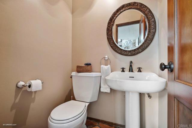 Powder room located off of the living room.