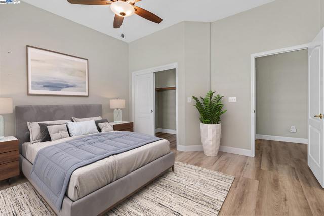 Spacious primary bedroom with walk-in closet. Virtually Staged.