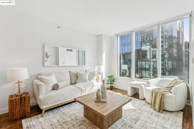Living room featuring healthy amount of natural light and wood finished floors