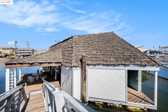 Dock featuring a water view and boat lift