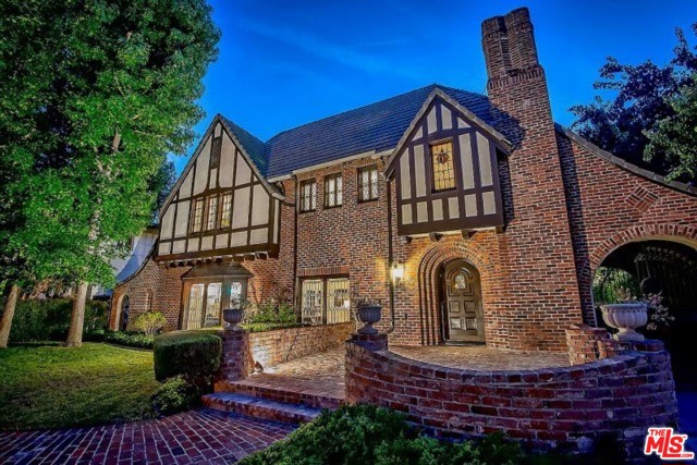 171 S Mccadden Place Los Angeles, California Magnificent and exquisite turn key English Tudor in Hancock Park. This property is created to entertain and enjoy living in sophistication and class. The gorgeous entry foyer leads to a step-down Formal Living Room with richly appointed fireplace. The gracious and formal Dining Room and Family Room with additional fireplace lead to an outdoor living area. This stunning residence was impeccably and entirely renovated in 2017 (new plumbing, air conditioning, electrical, roof and copper gutters.) Four wood burning European fireplace mantles. The gourmet custom kitchen with all solid wood cabinets, subzero fridge and freezer, Wolf oven, lead to an outdoor entertaining patio. Wine room and basement with temperature control for your collection. Artful and beautiful curved staircase to the landing to 4 bedroom suites and a third story playroom/office. 4 up/1down+GH apt for 6bd-7ba. Master luxury suite overlooking back yard with pool, spa, GH. Complete loveliness.