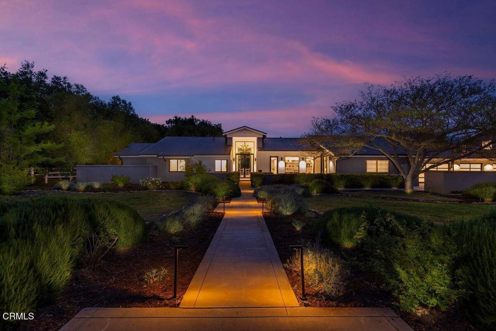 291 Saddle Lane Ojai, California Set within the coveted enclave of Persimmon Hill, 291 Saddle Lane is a private 3.8-acre retreat that embodies contemporary elegance and refined country living. Fully reimagined in 2017, this sophisticated ranch estate combines serene natural beauty with polished, high-functioning design--offering sweeping mountain vistas just minutes from downtown Ojai. At the heart of the residence is a professionally appointed kitchen, anchored by a dramatic Carrara marble island and a 48-inch BlueStar commercial range--an exceptional space for culinary artistry and social gatherings. Dual primary suites, each with spa-inspired en suite baths and expansive walk-in closets, provide versatility and discretion for hosting or multi-generational living. Enhancing the estate's resort-like appeal are a private, state-of-the-art screening room for 11+, a dedicated gym with stretch floor and ballet bar, a signature putting green, and a 620-square-foot music studio--each curated for leisure and lifestyle. A 780-square-foot, two-bedroom ADU offers additional accommodations with equal attention to design and comfort, while an attached five-car garage--fully finished--adds both practicality and presence. Beyond the interiors, the property features a private water well, a barn, and fenced horse pasture--ideal for equestrian use or tailored expansion. This estate is a rare offering: a secluded, amenity-rich sanctuary designed for those seeking privacy, elegance, and a true sense of place--nestled against a backdrop of Ojai's serene mountain ridgelines and just minutes from the village center.