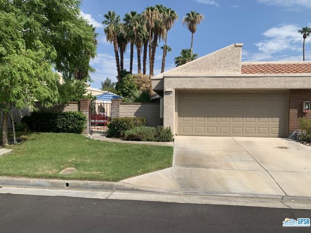 Don't miss a chance to own this beautifully updated condo in the popular West Gate neighborhood of Cathedral Canyon Country Club in Palm Springs. This 2 bedroom, 2 Bathroom with a den/office and 2 car garage has many upgrades. The updated kitchen has plenty of cabinet and counter space and newer stainless steel appliances. The living room boasts a built in unit with additional storage space and upper glass front shelves complete with a wine chiller. The den/office is perfect for your home office with French doors for privacy. The large front courtyard with wrap around patio is perfect for entertaining or just enjoying on your own. To top it all off, the home is complete with leased Solar. Close to shopping, restaurants and the Agua Caliente Casino. ********