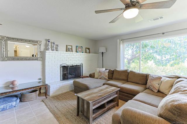 spacious living room with a custom pass-through into the dining room