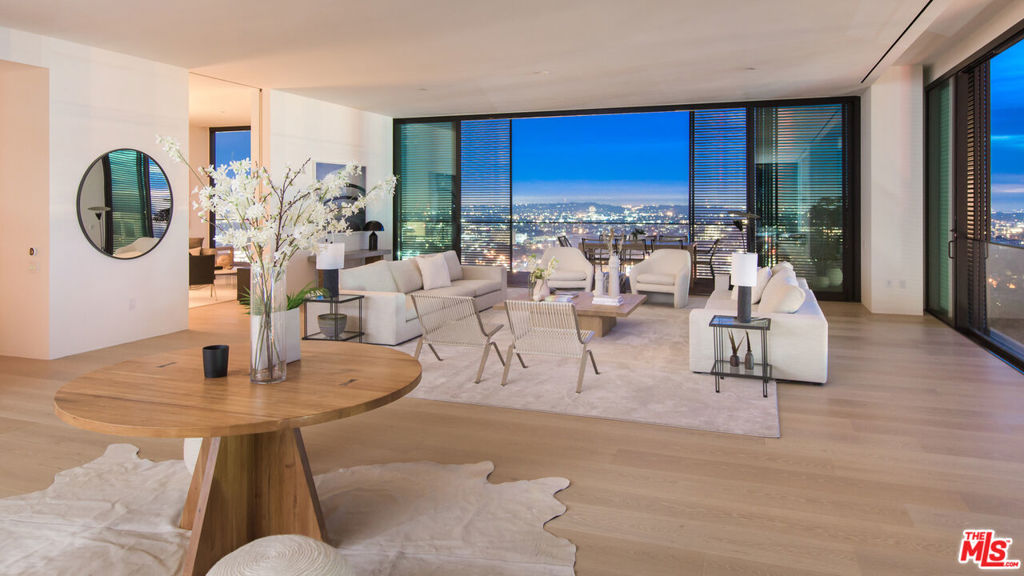 Welcome to the breathtaking Penthouse A, an architectural masterpiece meticulously crafted by AD100 architect John Pawson, showcasing sweeping panoramic views from Downtown LA to the Pacific Ocean. Spanning an impressive 6,415 Sq Ft of sleek living space, PHA redefines Los Angeles luxury with floor-to-ceiling windows and walls of glass that seamlessly connect the interiors to an 834-sq-ft glass-wrapped loggia: an unparalleled indoor-outdoor experience.Every detail in PHA is curated for elevated livingfrom the sophisticated teak and Basaltina stone Molteni kitchen with a striking island and top-tier Miele appliances to the expansive primary suite featuring a midnight bar, custom dressing room, and luxurious bath. A junior suite and two additional en suite bedrooms offer indulgent design and stunning views. PHA also boasts a spacious media room, laundry, and well-appointed butler's pantry.Residents enjoy The Edition's exceptional amenities, including a 24-hour attended lobby, valet parking, outdoor lounge, and expansive rooftop pool, all in a prime Sunset Blvd location offering unmatched service, privacy, and sophistication. Additional onsite features include a signature restaurant, lobby lounge, basement club, and a 6-treatment room spa. Welcome to the ultimate residence that exceeds all expectations and redefines luxury living in the heart of Los Angeles.