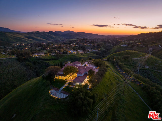 Situated atop a sprawling 20+ acre lot, this magnificent estate is perched on a private hill within the highly sought-after gated community of Lexington Hills. The community is renowned for its exceptional education opportunities, being part of an award-winning school district. As you approach the estate, you'll be greeted by a private, gated entrance leading to a long, winding driveway that leads to your very own serene oasis. The estate's elevated position provides uninterrupted 360-degree views of the surrounding landscape, making it a truly breathtaking sight to behold. This residence has undergone significant renovation, including the installation of a new wifi tower to provide high-speed internet, generators, and a complete water filtration system. Spread across two floors, the property offers more than 11,000 square feet of lavish living space. The property boasts eight ensuite bedrooms and ten bathrooms, each designed with intricate attention to detail, to ensure maximum comfort and relaxation. The pool area is a true work of art, showcasing a pool, two hot tubs, a waterfall, a water slide, and a swim-up bar, creating an ideal setting for hosting unforgettable events and entertaining guests. Whether you enjoy hiking, horseback riding, or simply relaxing in the serenity of your private retreat, this property has it all. Don't miss the opportunity to own this exceptional estate and create unforgettable memories.