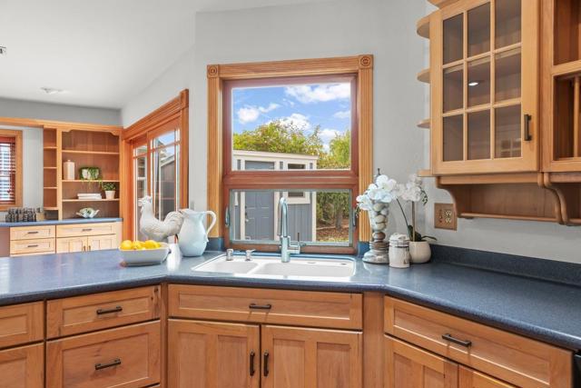 overlooking the patio and yard, with sliding glass door to patio, great for entertaining. 