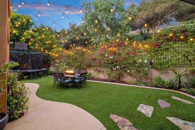 Plenty of room to entertain in this beautiful backyard that stays green all year long!  The fun with family and friends is enhanced by Bose Speakers!