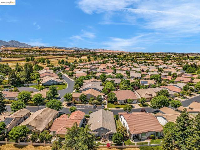 Aerial perspective of suburban area with a mountain backdrop