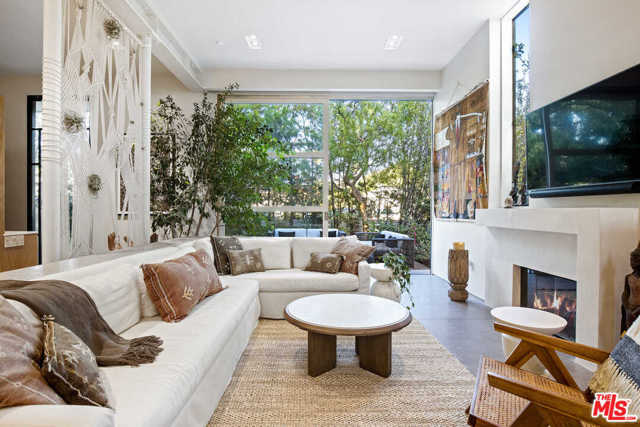 2341 Wilson Avenue Venice, California Experience exquisite European design detail only steps away from Abbot Kinney and nearby beaches. Designed by Kim Gordon, this modern home is special from any perspective. Behind the smart-home security front-gate and 20-foot-tall hedges, is a bright and elegant outdoor entry courtyard. From the courtyard, enter the home either through a 12-foot glass and steel front door, or the floor-to-ceiling glass-paned slider. The open floor plan of the ground floor effortlessly joins cooking, dining, and outdoor lounge space, immediately giving you the feeling of bright and easy living. Dappled sunlight spills in through the primary suite balcony. A great place to enjoy morning coffee unless you'd prefer the coffee bar on the third floor, which also includes two sunlit bedrooms, a lounge space, office/library and pocket-sliding door balcony. A large covered, panoramic view rooftop, w/built-in fireplace, provides the perfect place to patio-dine with the family or the luckiest of friends.