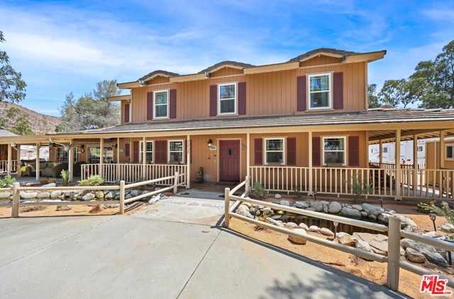 32920 Joshua Avenue Acton, California This truly one of a kind equestrian estate can now be yours! The estate comes complete with Main Residence, Guest Quarters and a COMPLETE horse training facility. The ranch style, 2 story main residence features approx 2,400 sq ft, 3 Bdrms, 2.5 baths and the property boasts 3.3 flat fully fenced and cross fenced useable acres. When you arrive to the property you will be welcomed by a circular drive way which will take you to large water feature, fish pond, creek and a waterfall. Wrap around porch provides shade and comfort. First floor of the house has a combination of hardwood floors and Italian tile floors, crown molding and chair rails. The kitchen is large and offers stainless steel appliances, including a brand new dishwasher. Second floor has brand new carpet, newly remodeled master bathroom with an oversized walk-in closet and dressing area, plus an additional 3 spacious bedrooms and another full bathroom. The whole house has new energy efficient windows. Central AC and heating is provided by a newer model (2017) energy efficient electric heat pump. No worries about the electric bill here; Seller spent over $60,000 recently installing a oversized solar panel system (32 panels). There are also two separate solar panels designated just for water heating purposes. Moreover the property features a 16 horsepower whole house generator so those planned rolling black-outs wont inconvenience you! The property has a functional well and two 5000 gallons water storage tanks. In the back of the main house there is a mobile home, 2 bedrooms one bath, 720 sq. feet with a private yard, ideal for guests or in-laws. On the right side of the house there is 25 ft. long travel trailer (Coachman, 2007) hooked up to a septic tank, water, electricity and cable TV, and it has its separate fenced yard, ideal for ranch hand / helper / premise keeper living area. Equestrian area offers a nice size wood (beams) built barn with 4 fully matted extra large stalls, each with paddock area. There is a fifth stall adjacent to the barn that was used as a foaling stall. There are two dressage riding arenas; one of them is a full size (FEI regulation) and has stadium lights. The other is half size, fully fenced and has a mirror, ideal for training a young horse. Both of the riding arenas are professionally graded with a 1 degree slope for drainage. Two large turn-out areas with shaders. Extra large hay barn offers plentiful storage for hay, shavings and tractor. Two tack rooms, cross ties, wash rack and a separate water heater for horse baths. Equestrian part of the property is fully fenced with white vinyl coated fence, has a separate circular driveway with two pairs of extra large gates and plenty of space for your horse trailer. For serious equestrians, this is your dream property come true.
